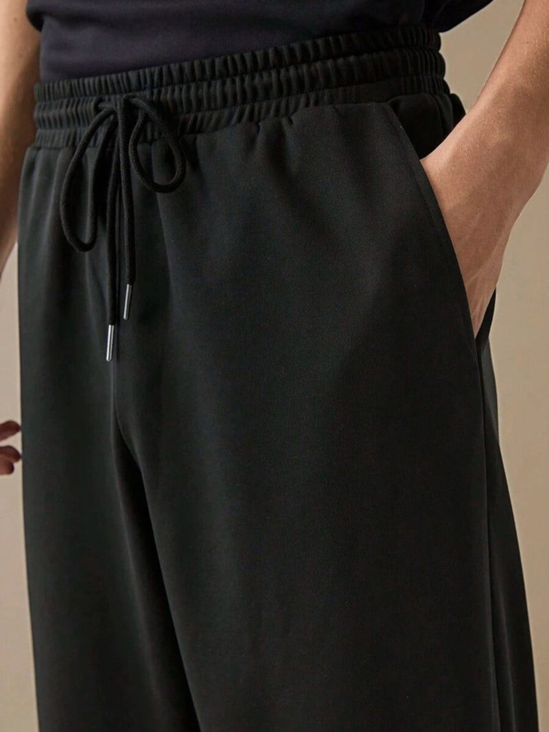 فلاينوف بنطلون رياضي رجالي كوري أسود بقصة فضفاضة - Image 3